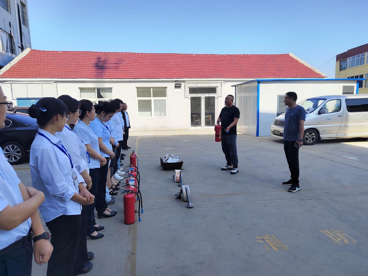 Qianyi staff attending fire‑safety classroom training session