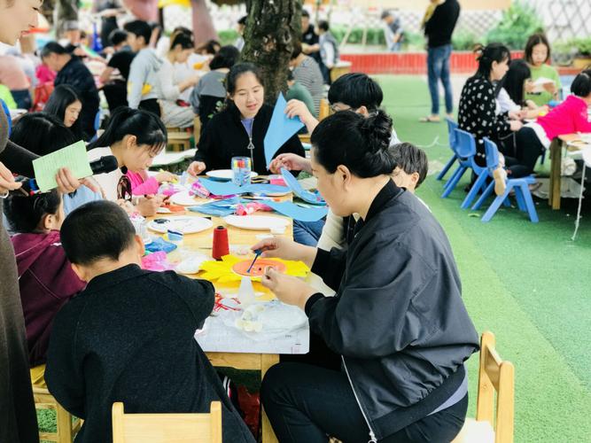 Children making creative handicrafts from paper‑plates on site